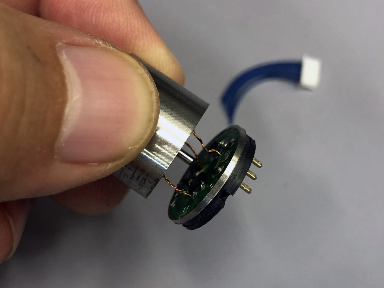 Extreme close up photo of a ProModeler brushless motor cut open with a lathe to reveal the leads to the sensors