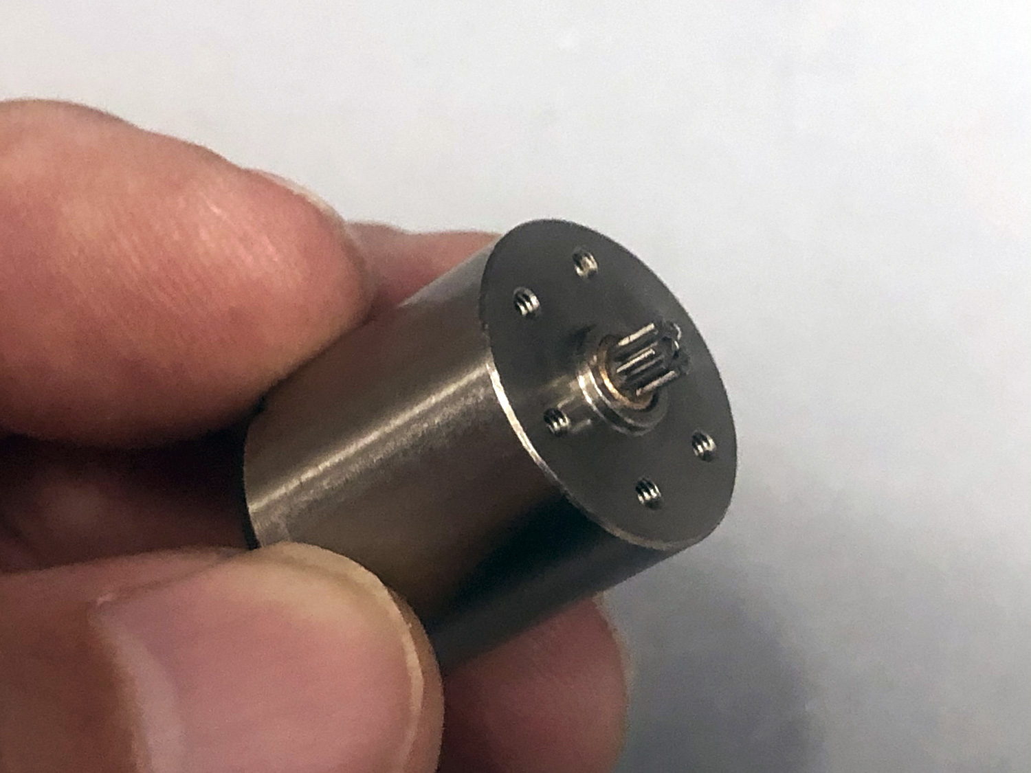 Photo of fingers holding a ProModeler coreless servo motor