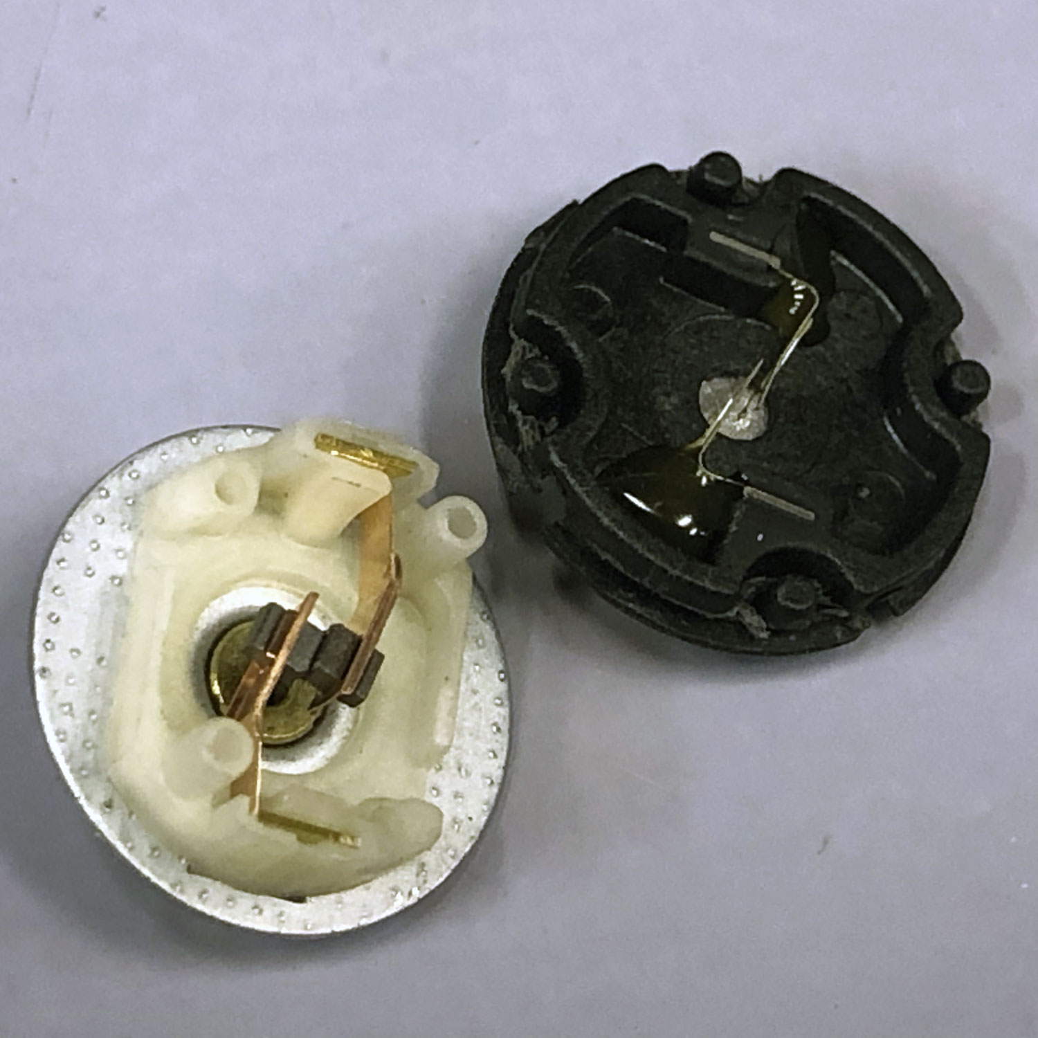 Close up of massive DC-motor brushes vs dainty coreless motor brushes