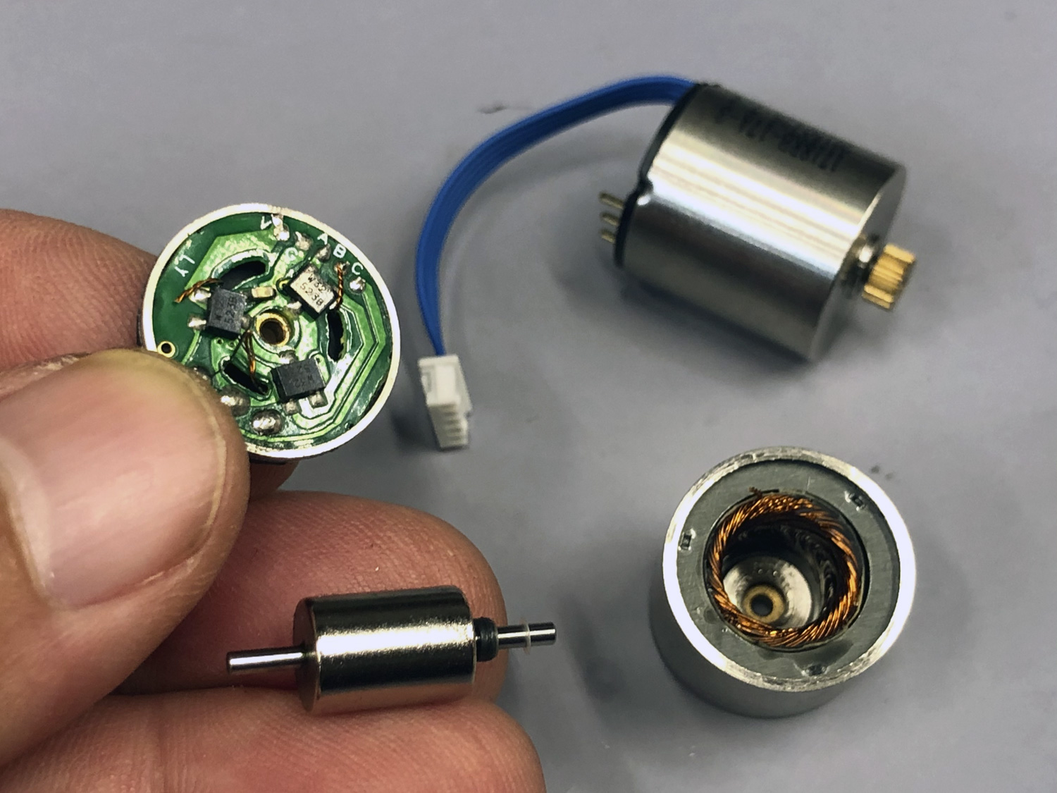 Close up photo of the components of a ProModeler servo's brushless motor’s commutation (field switching) through Hall effect sensors for magnetically measuring the rotor position